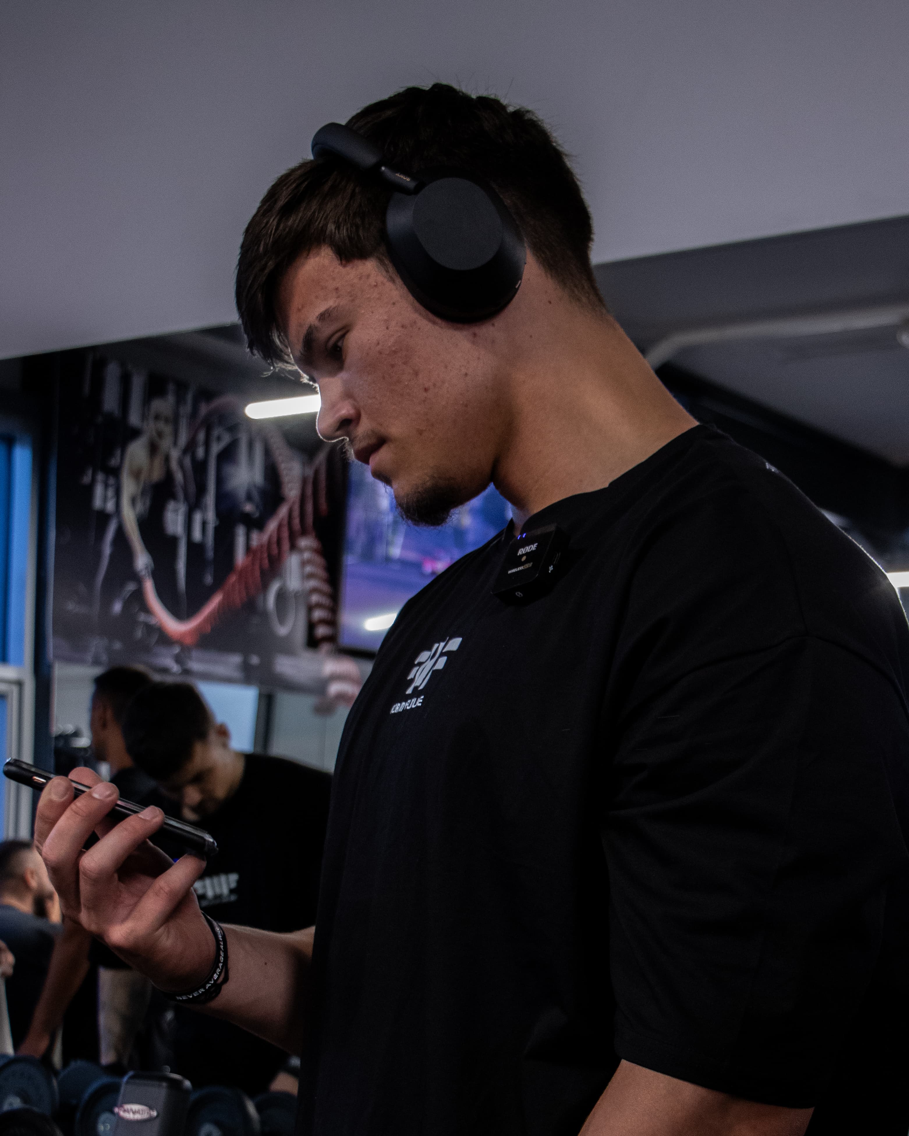 Leo coaching and filming content in the gym
